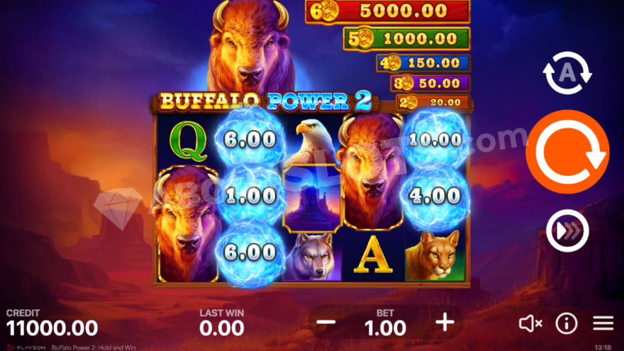 Base game with a large buffalo visible behind the reels.