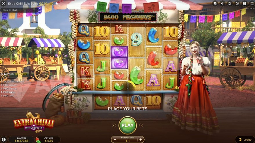 Mexican fruit market with a slot machine in the center on the counter and a presenter in front of it.