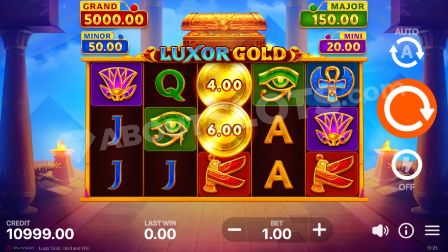 Base game view featuring pyramids in Luxor Gold: Hold and Win slot.