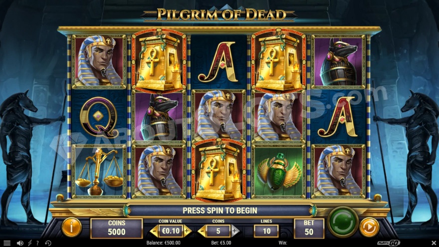 Base game showing two large jackal statues flanking the reels.